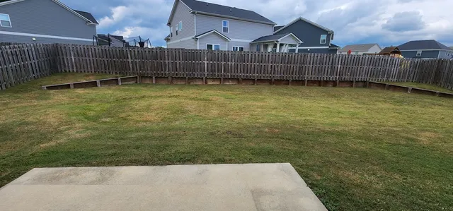 a view of a deck with a yard