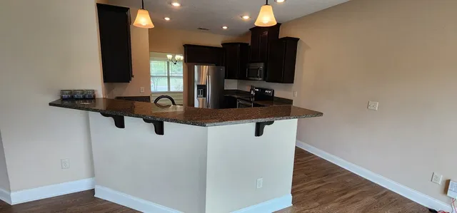 a bathroom with a sink a mirror and vanity