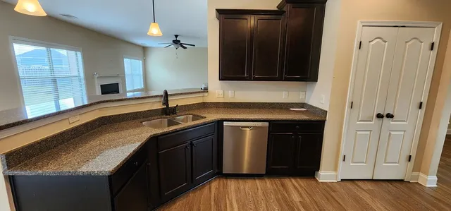 a kitchen with a sink and a mirror