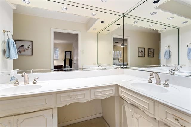 1535 Infinity Lane Beaumont, TX 77706 - Photo 21 of 35 a bathroom with a sink and a mirror