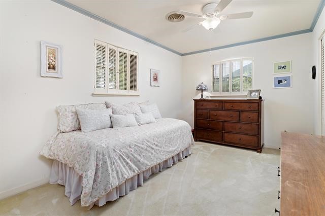 1535 Infinity Lane Beaumont, TX 77706 - Photo 22 of 35 a living room with a bed and furniture