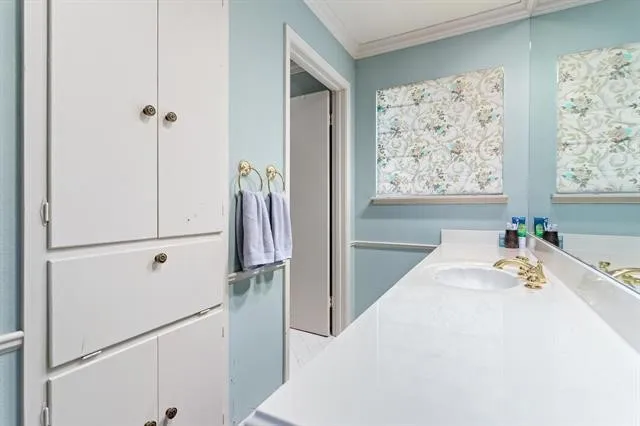a white bath tub sitting next to a window