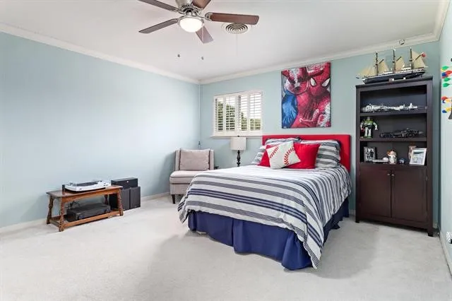 a bedroom with a bed and dresser