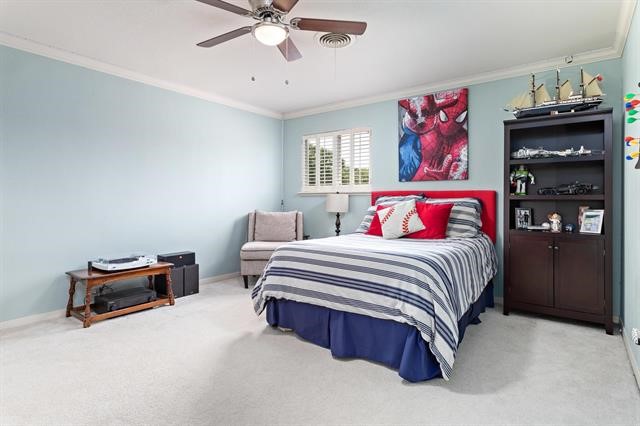 1535 Infinity Lane Beaumont, TX 77706 - Photo 30 of 35 a bedroom with a bed and dresser