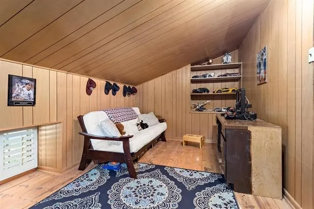 a bedroom with furniture and a rug