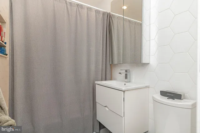a bathroom with a sink a vanity and a mirror