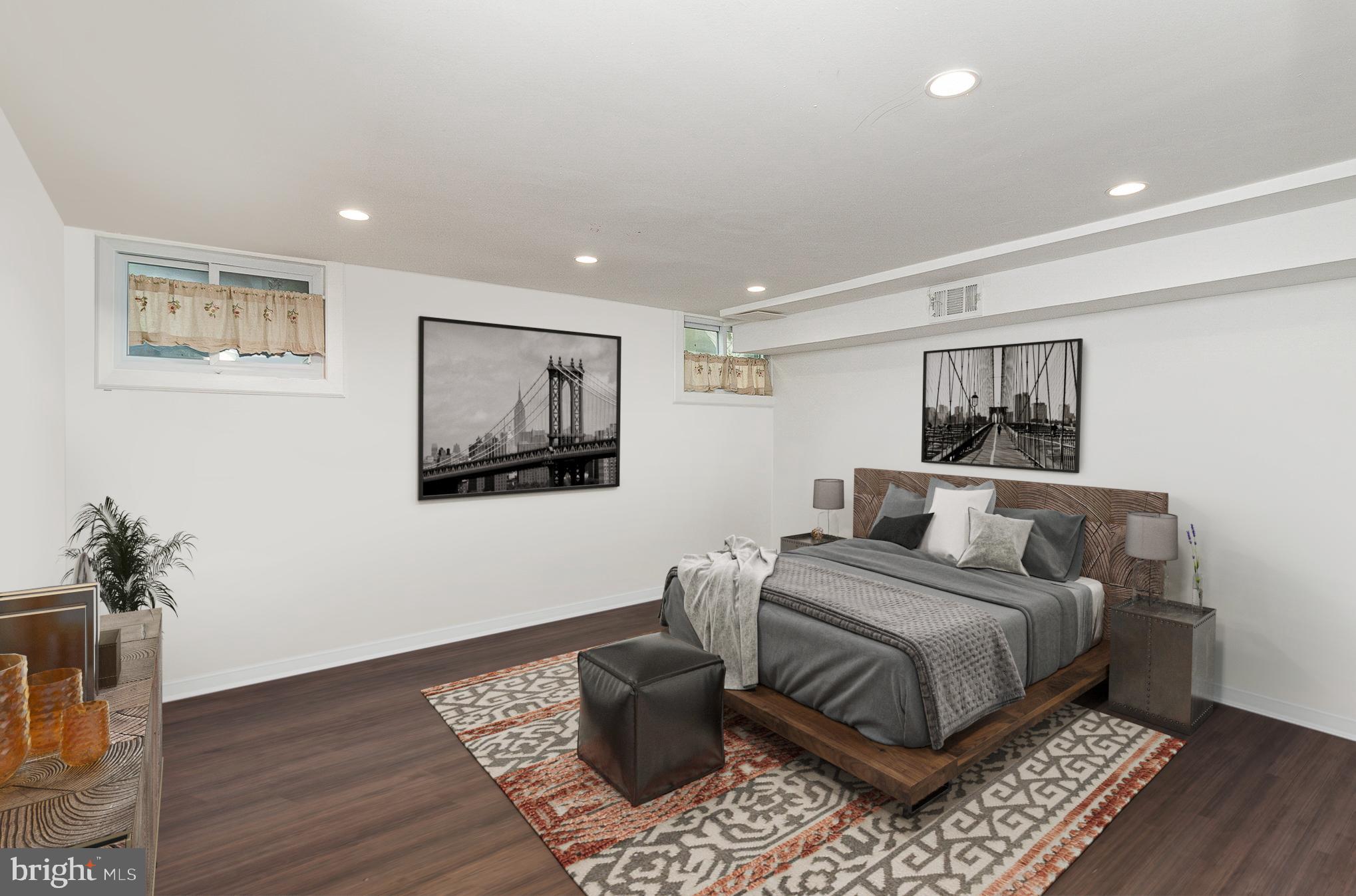 1338 4th Street Southwest, Unit T1338 Washington, DC 20024 - Photo 14 of 24 a bedroom with a bed and a painting on the wall