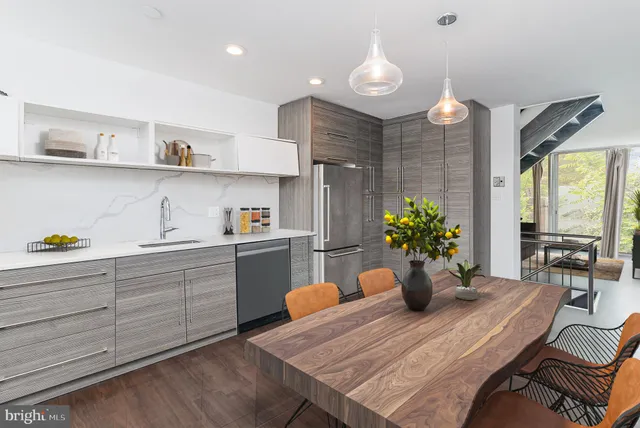 a kitchen with a table and chairs