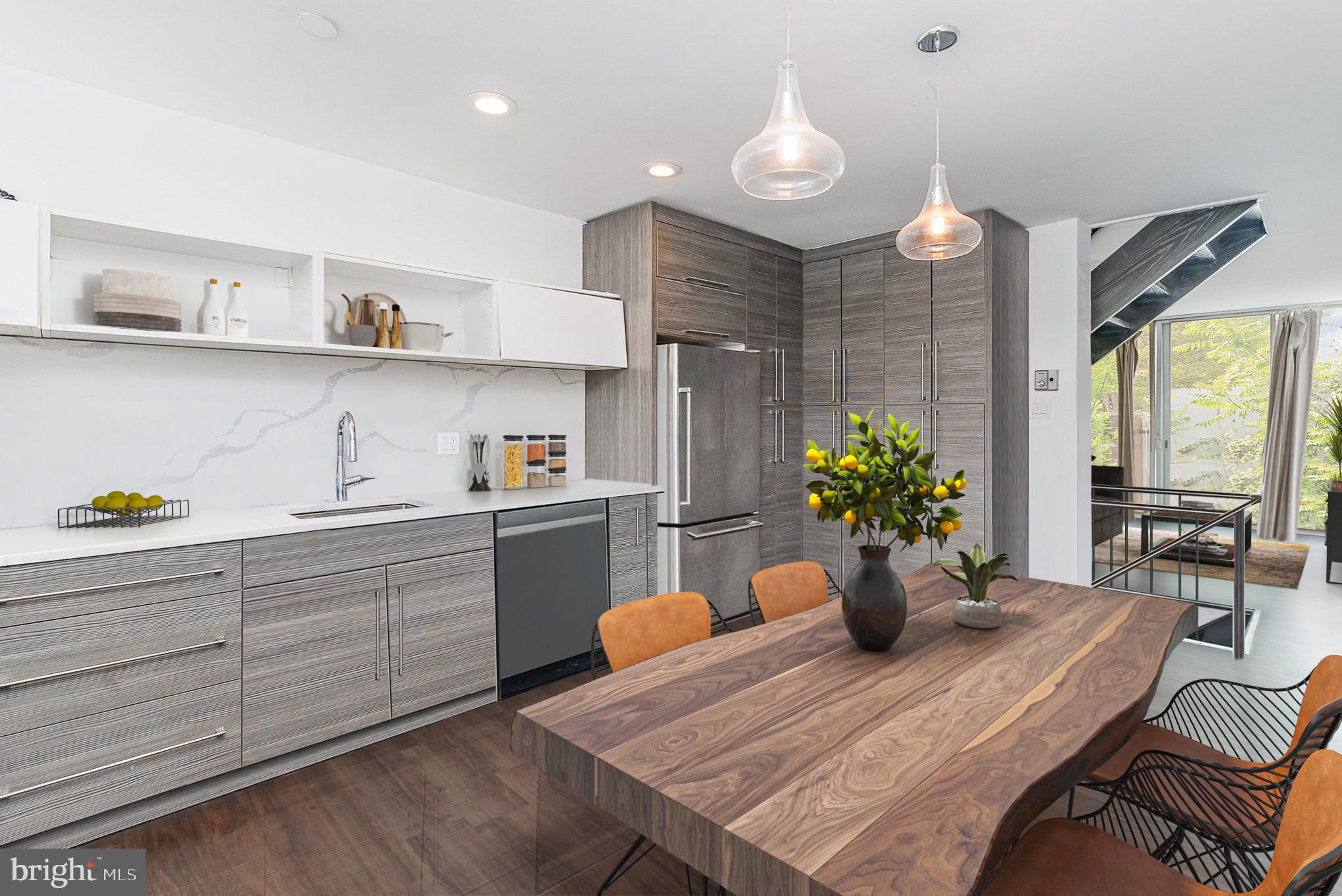 1338 4th Street Southwest, Unit T1338 Washington, DC 20024 - Photo 3 of 24 a kitchen with a table and chairs