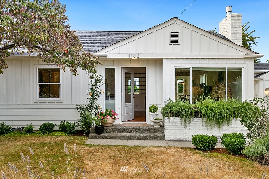 1102 North 30th Street Renton, WA 98056 - Photo 2 of 38 a front view of a house with a yard