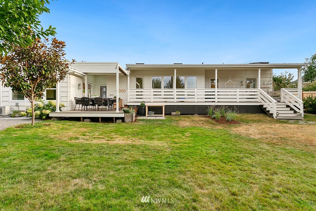 1102 North 30th Street Renton, WA 98056 - Photo 37 of 38 a front view of a house with a garden and porch
