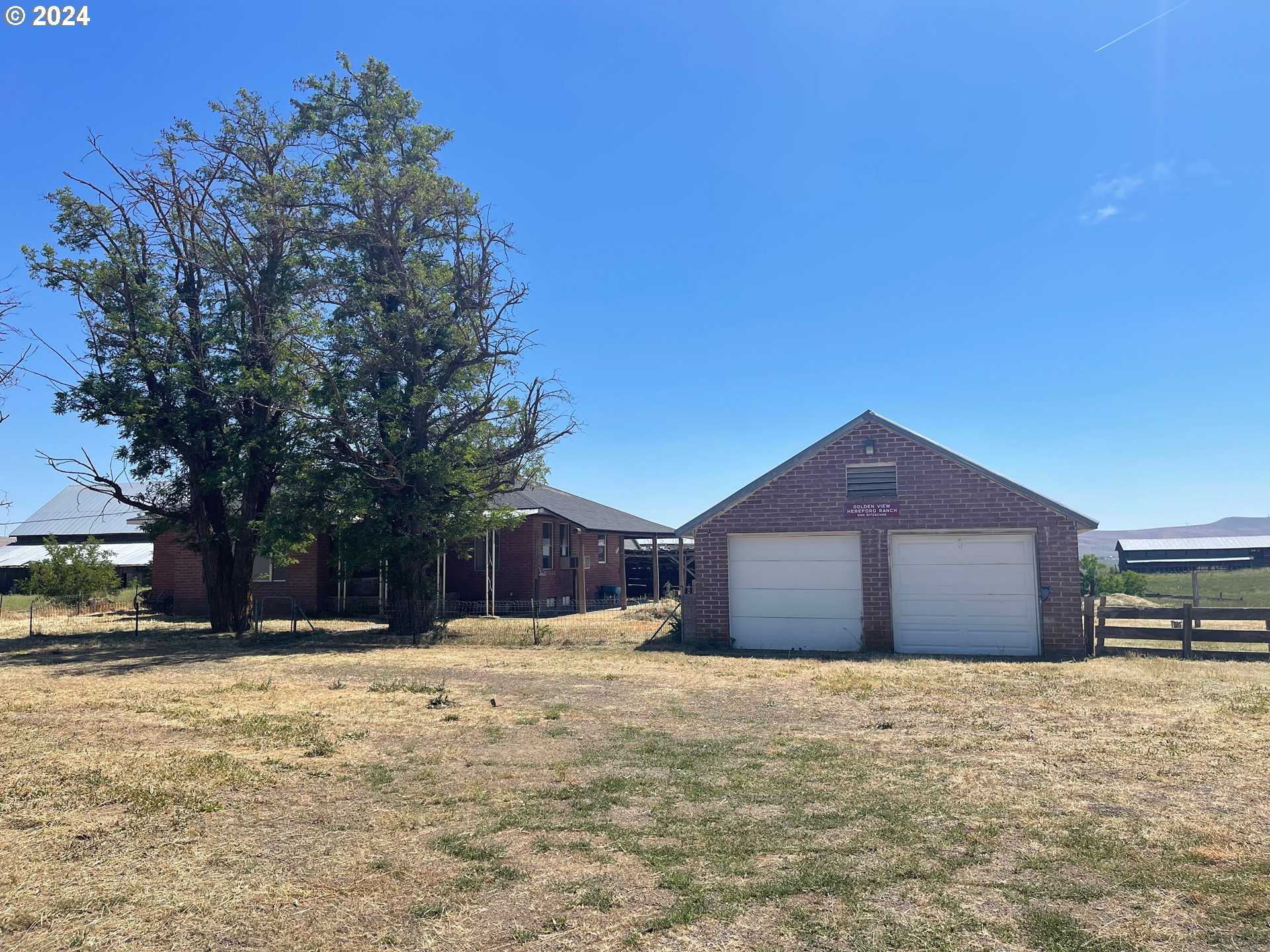 242 Van Hoy Road Goldendale, WA 98620 - Photo 11 of 44 a front view of a house with a yard