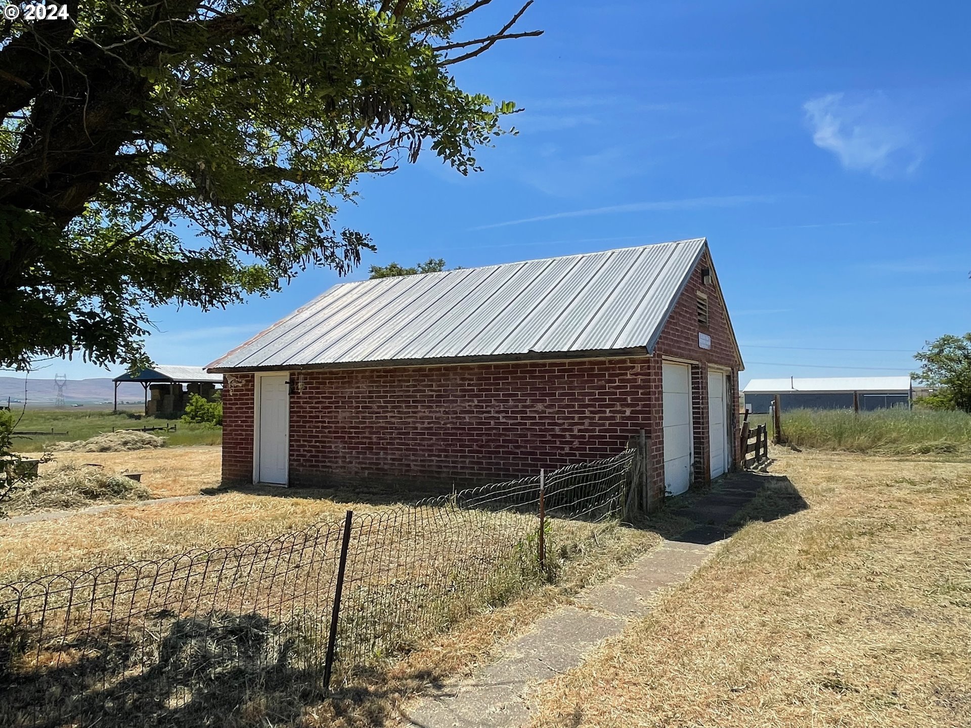 242 Van Hoy Road Goldendale, WA 98620 - Photo 12 of 44 a view of a backyard of the house