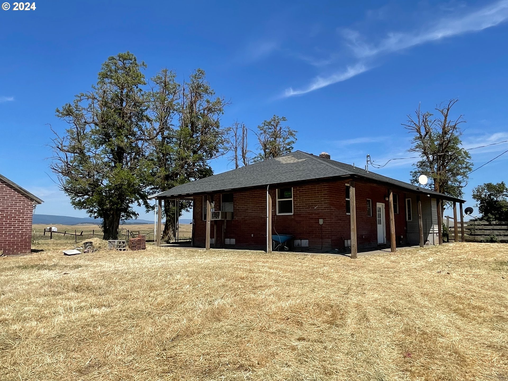 242 Van Hoy Road Goldendale, WA 98620 - Photo 15 of 44 a view of a house with a yard