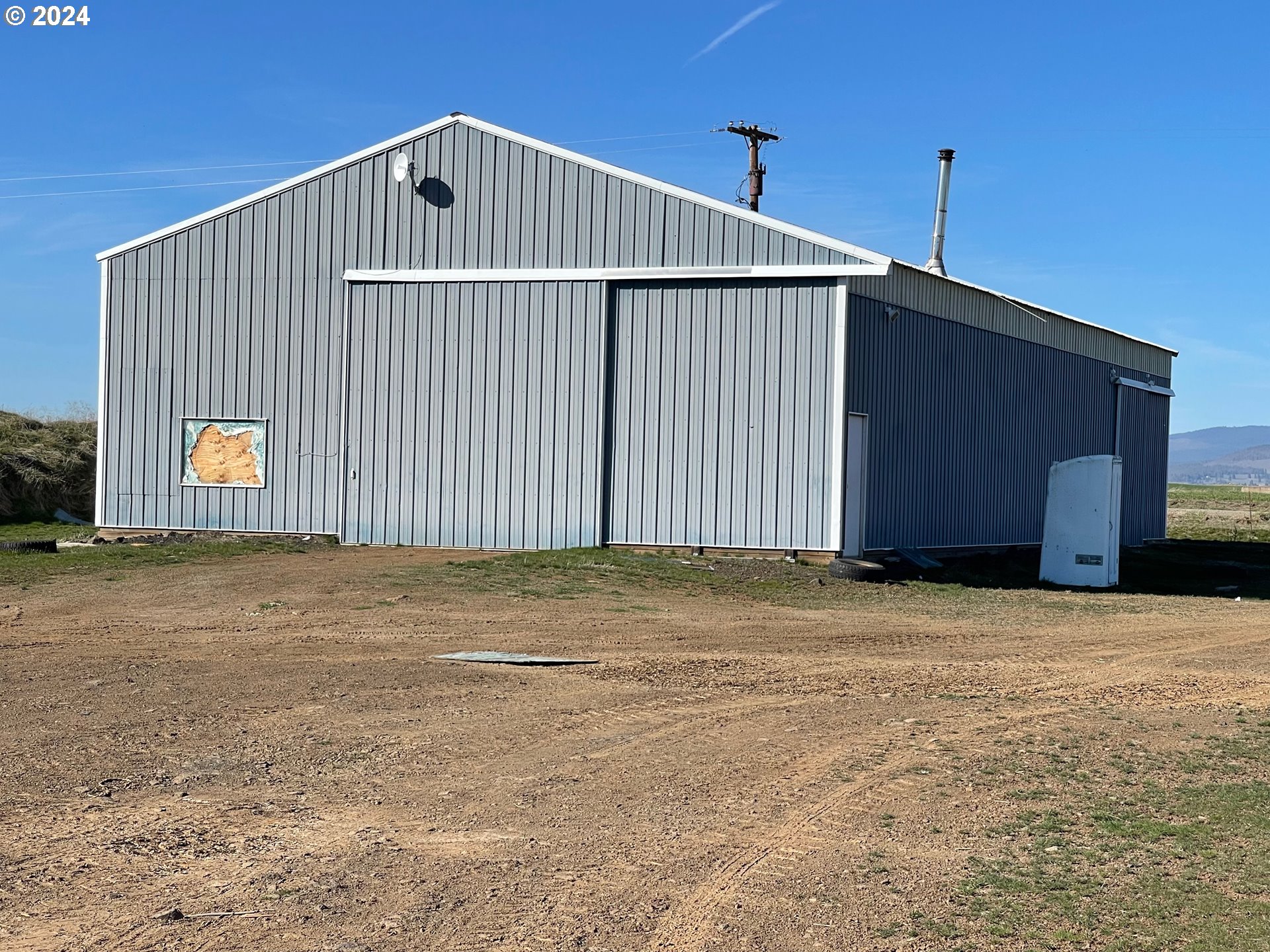 242 Van Hoy Road Goldendale, WA 98620 - Photo 29 of 44 a front view of a house with a yard