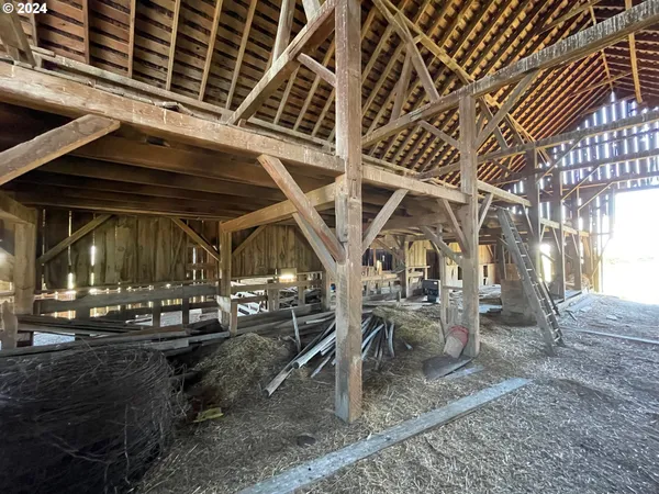 a view of a house with yard and trampoline