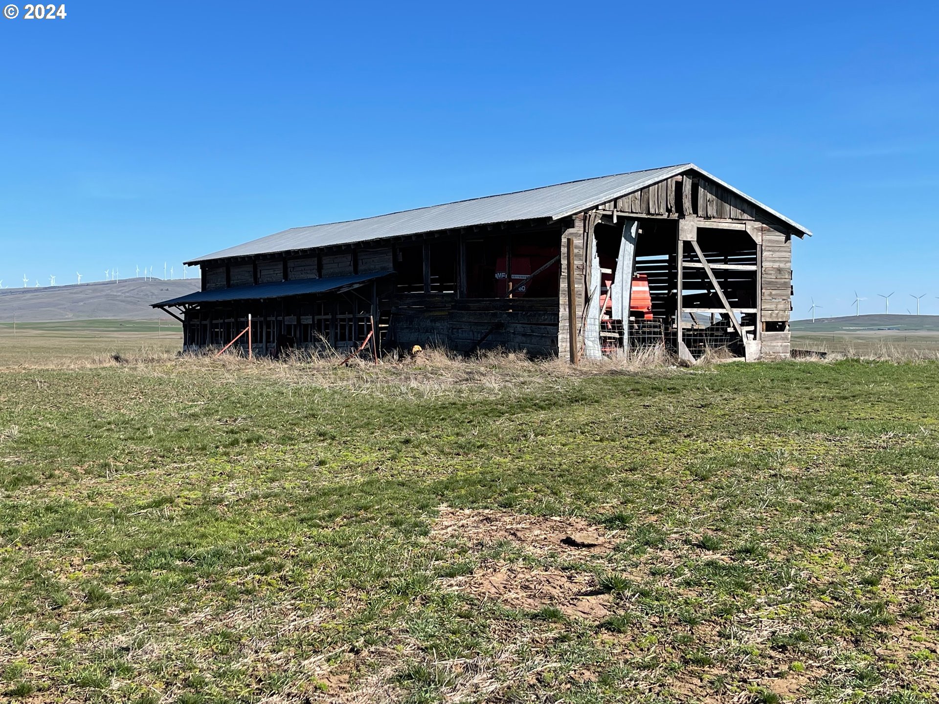 242 Van Hoy Road Goldendale, WA 98620 - Photo 35 of 44 a view of a house with yard and trampoline