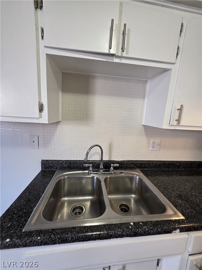 1075 East Desert Inn Road, Unit 5 Las Vegas, NV 89109 - Photo 10 of 12 A well-appointed kitchen sink with sleek fixtures stands ready for culinary tasks.
