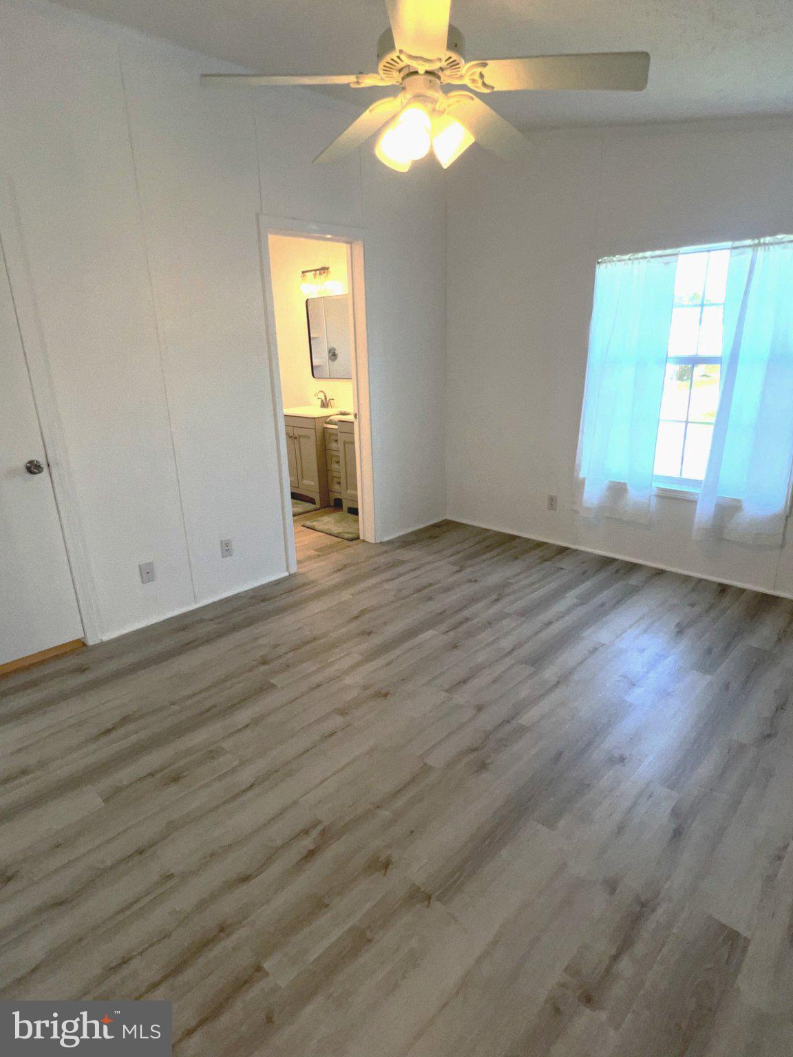 7 Colonial Lane Rehoboth Beach, DE 19971 - Photo 12 of 18 Bright and airy master bed room with modern charm.