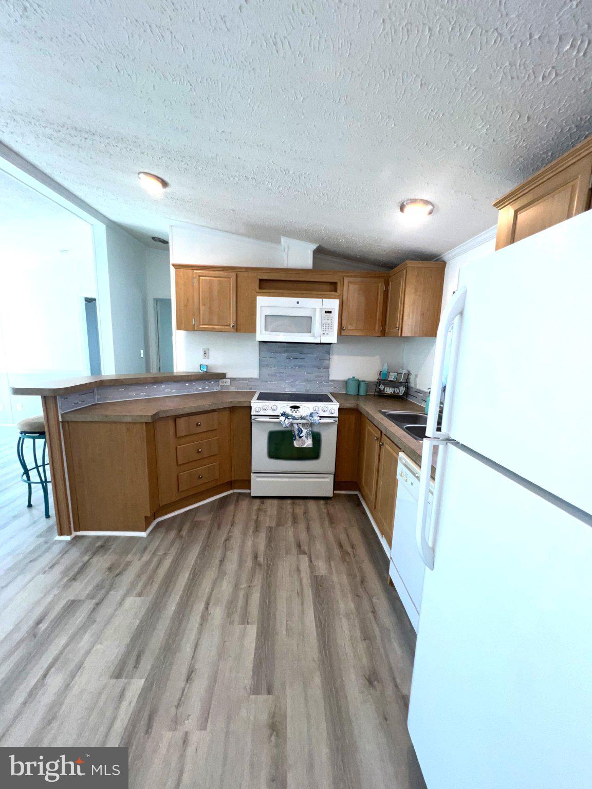 7 Colonial Lane Rehoboth Beach, DE 19971 - Photo 8 of 18 Bright and inviting kitchen space.
