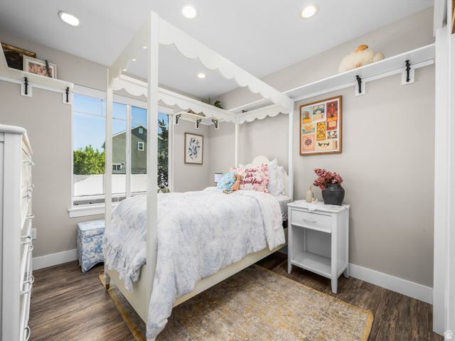 7 Sterling Loop Vineyard, UT 84059 - Photo 27 of 43 Spacious bedroom featuring wood-finish flooring, recessed lighting, and a large window