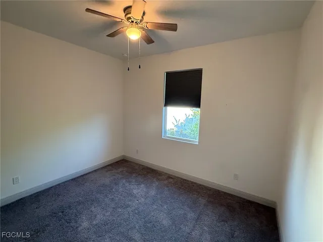 a bathroom with a sink a toilet a mirror a bathtub and shower