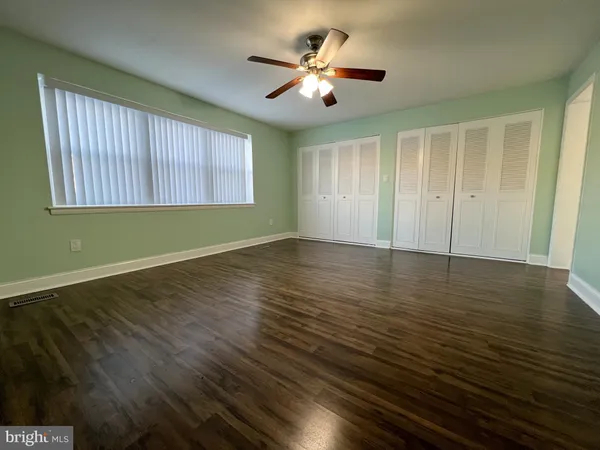 a view of room with window and ceiling fan