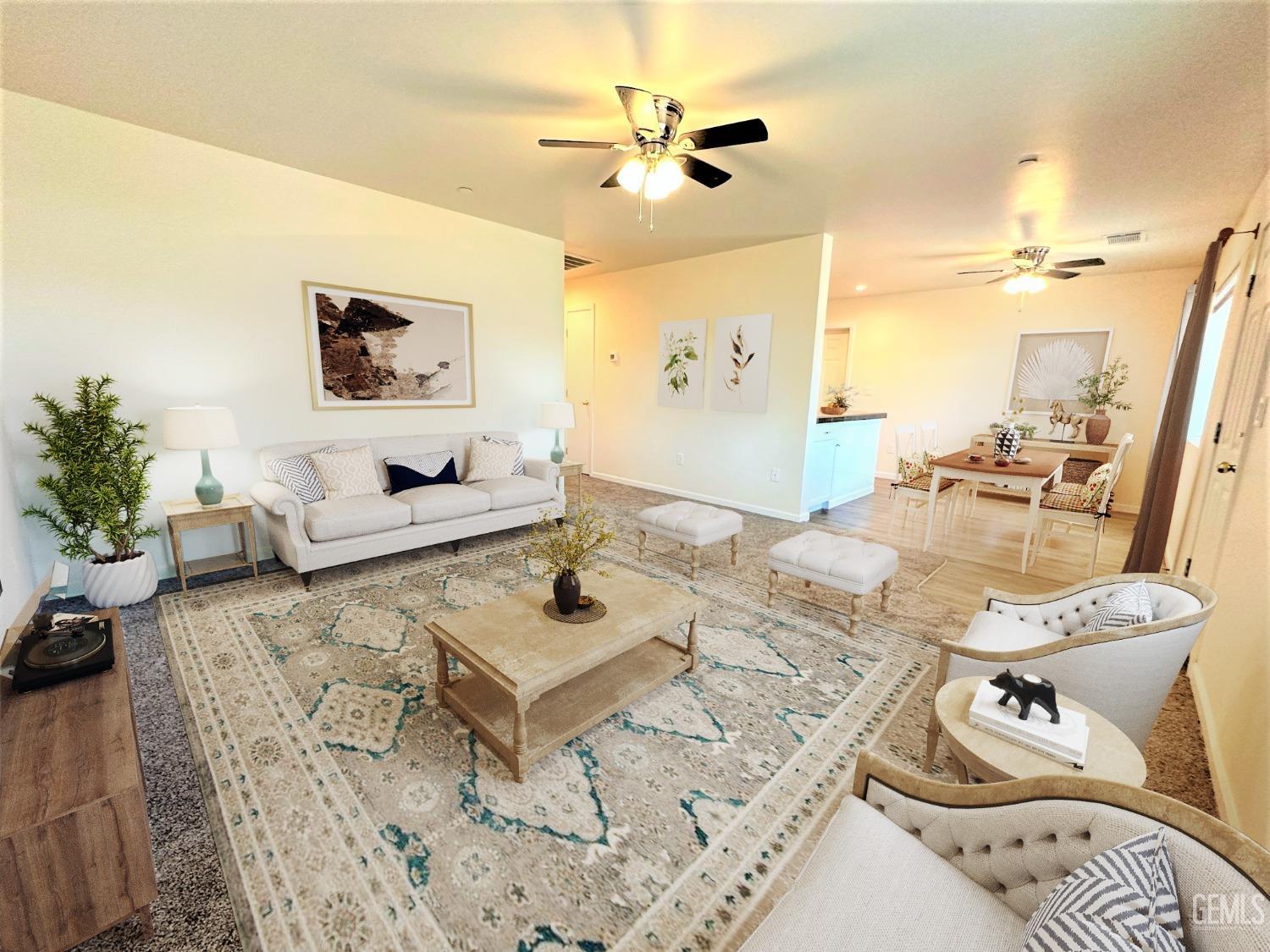 Undisclosed Address Bakersfield, CA 93307 - Photo 2 of 10 a living room with furniture and a table