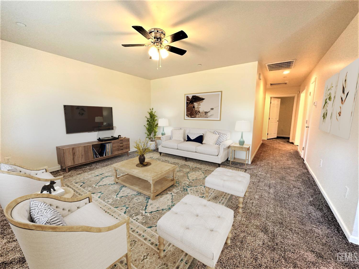 Undisclosed Address Bakersfield, CA 93307 - Photo 3 of 10 a living room with furniture and a flat screen tv