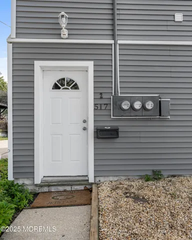 a view of a wooden door of the house