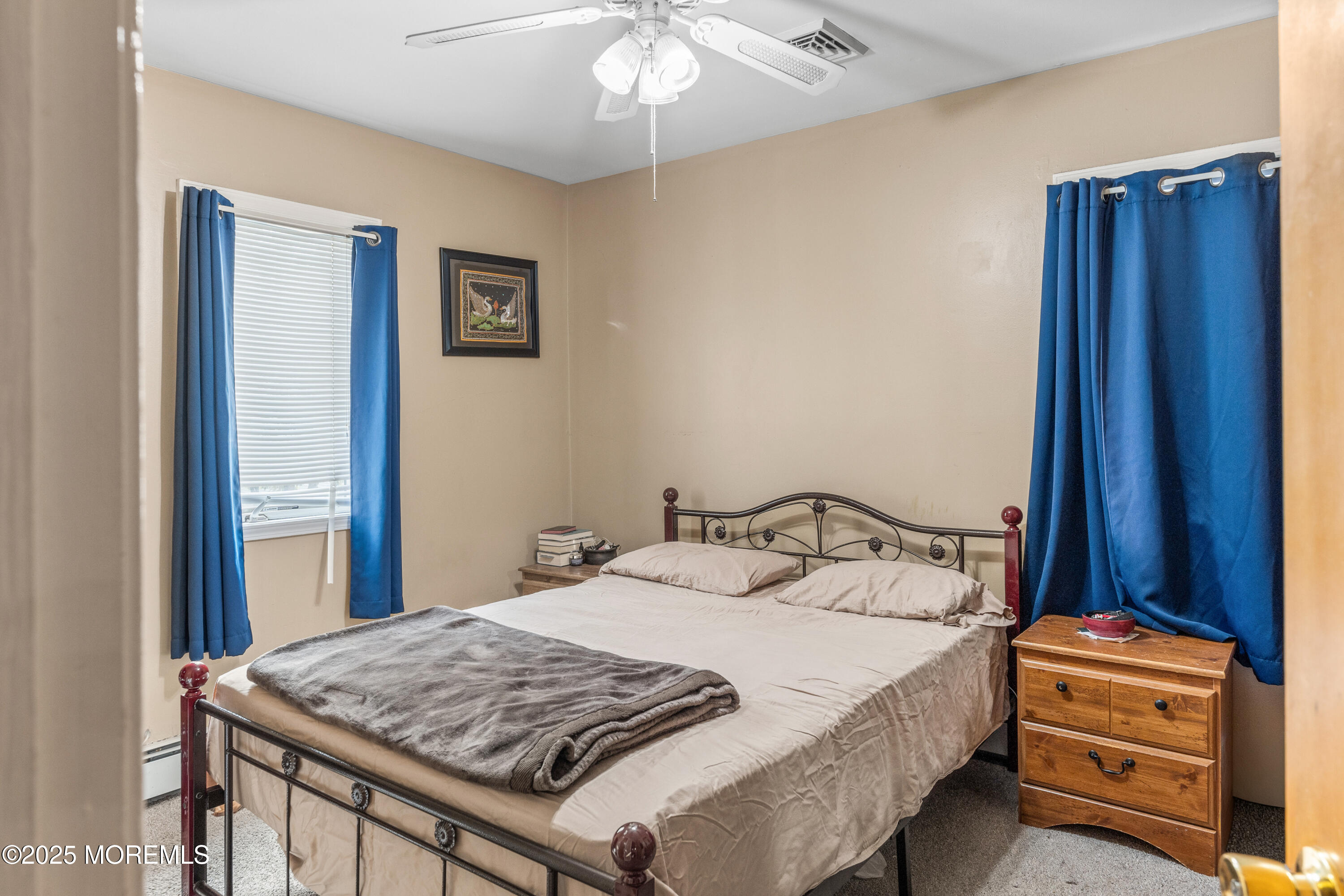 517 14th Avenue Belmar, NJ 07719 - Photo 22 of 31 a bedroom with a bed and a dresser
