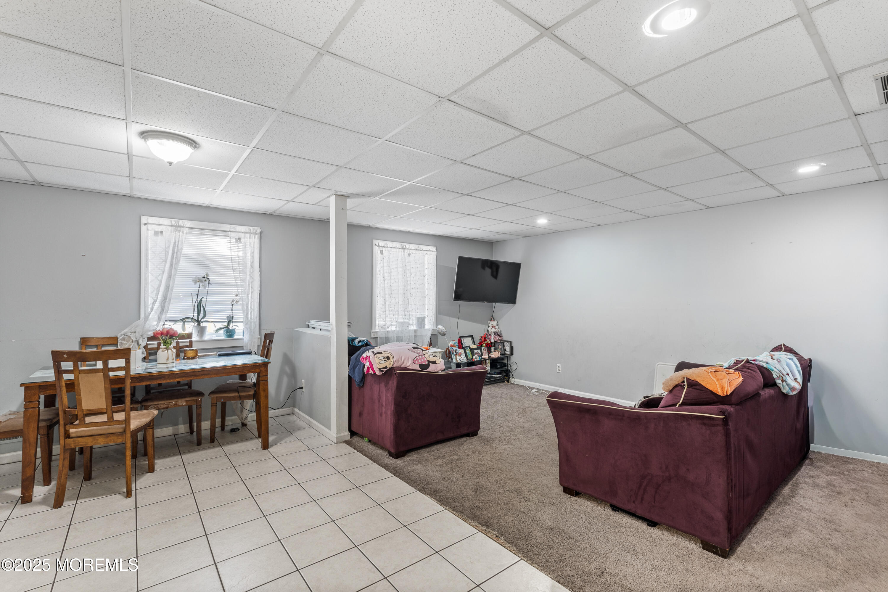 517 14th Avenue Belmar, NJ 07719 - Photo 26 of 31 a living room with furniture and a flat screen tv