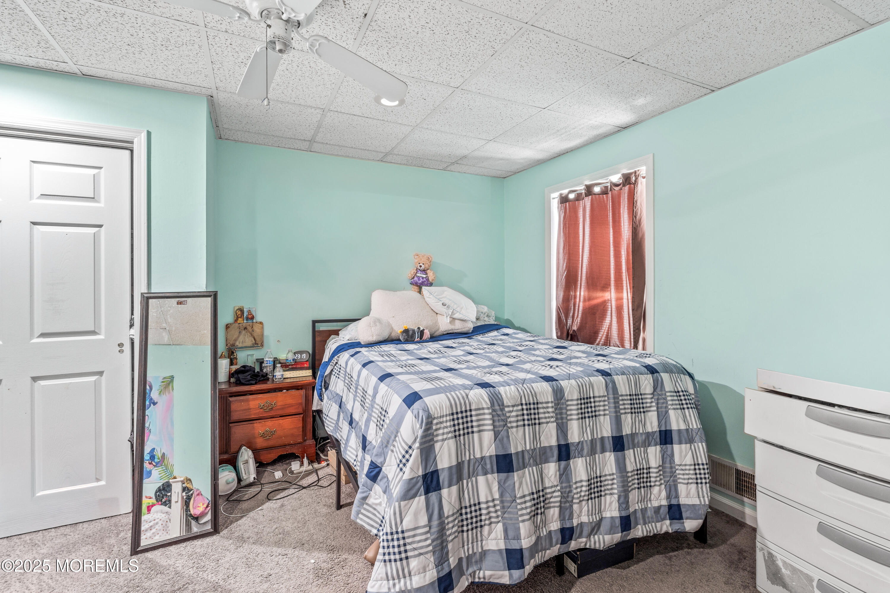 517 14th Avenue Belmar, NJ 07719 - Photo 29 of 31 a bedroom with a bed and wooden floor