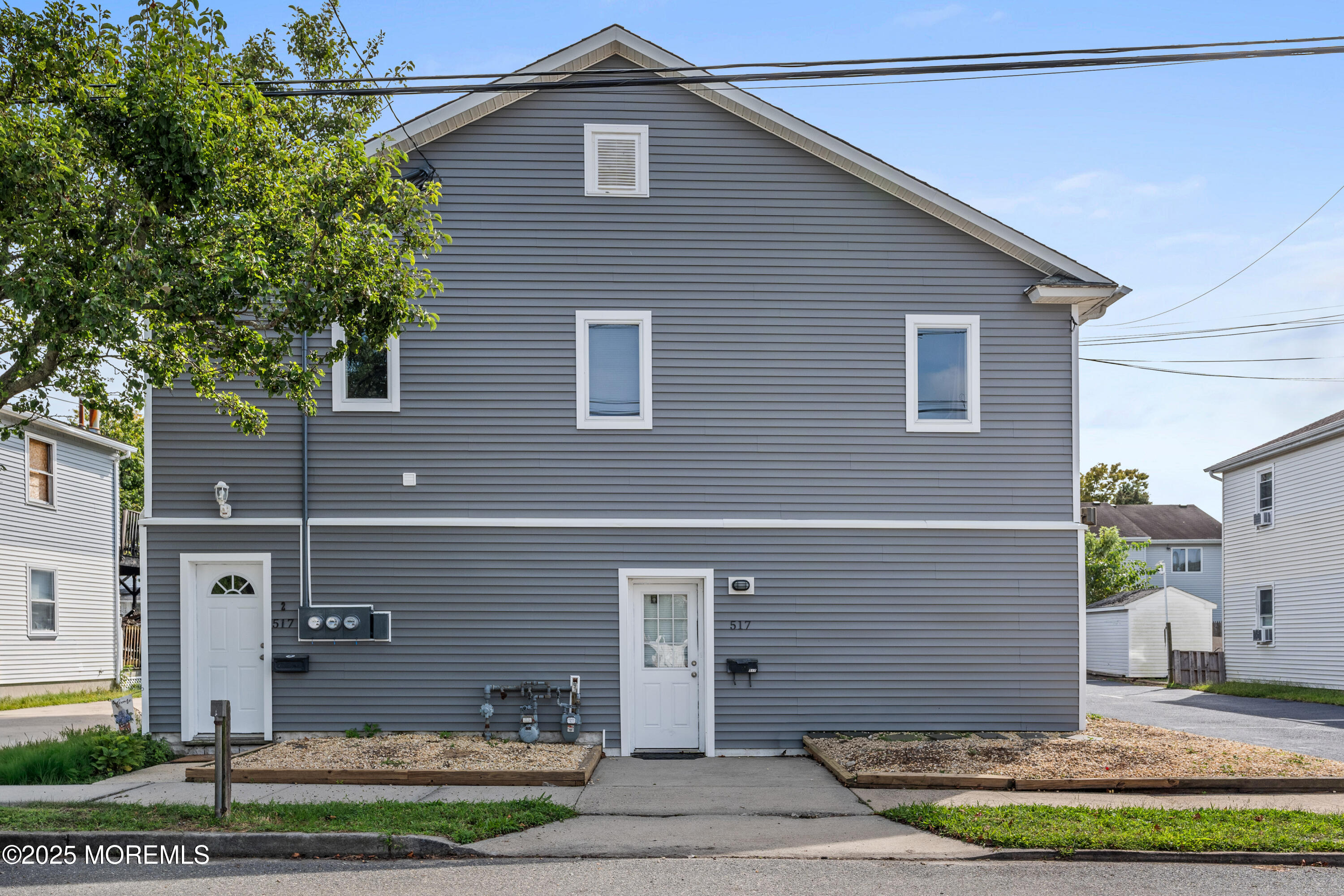 517 14th Avenue Belmar, NJ 07719 - Photo 3 of 31 a front view of a house with a yard