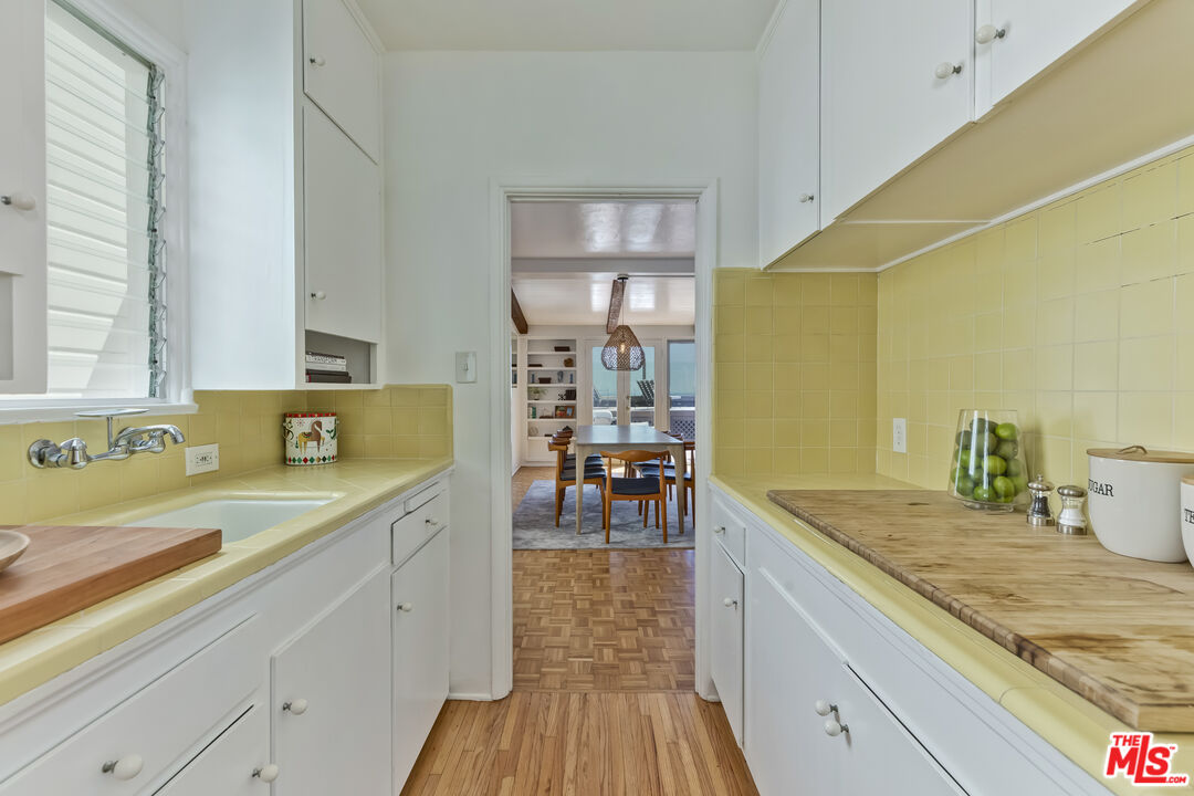 23350 Malibu Colony Road, Unit 109 Malibu, CA 90265 - Photo 13 of 61 a view of a kitchen with a sink and cabinets