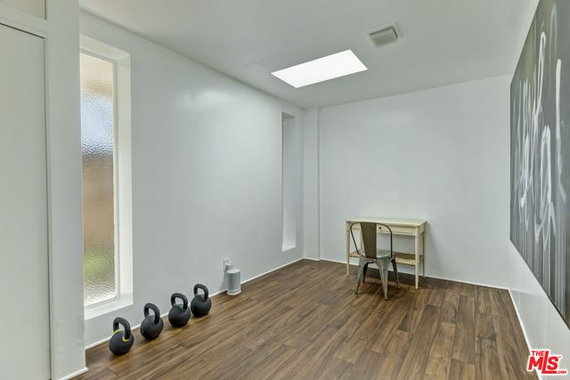 a bedroom with a bed and a chair