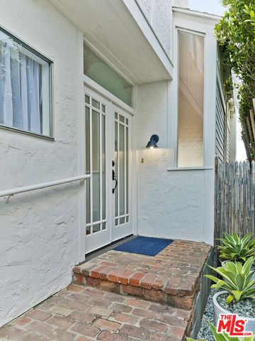 a kitchen with a sink cabinets and window
