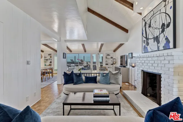 a bedroom with a bed and chair