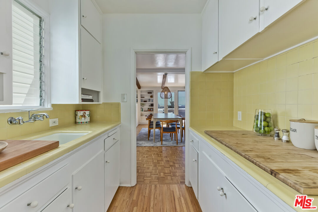 23350 Malibu Colony Road, Unit 109 Malibu, CA 90265 - Photo 43 of 61 a view of a kitchen with a sink and cabinets