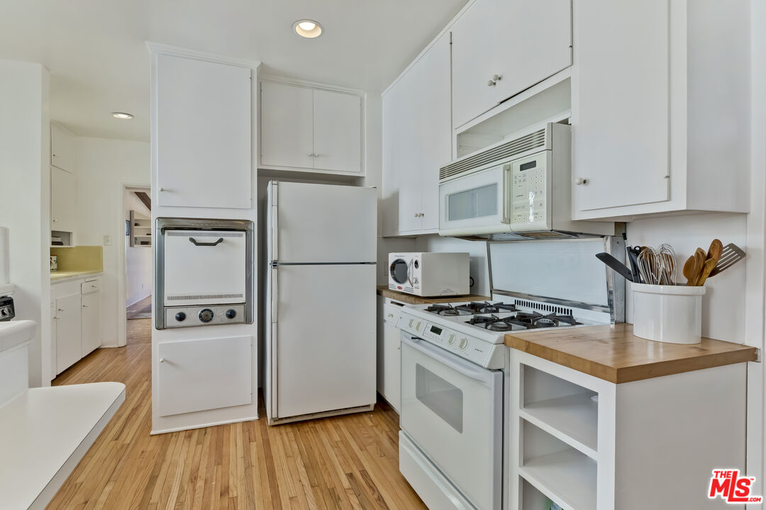 23350 Malibu Colony Road, Unit 109 Malibu, CA 90265 - Photo 46 of 61 a kitchen with stainless steel appliances a refrigerator stove and sink