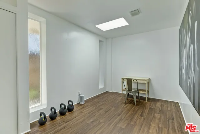 a view of a patio with a table and chairs