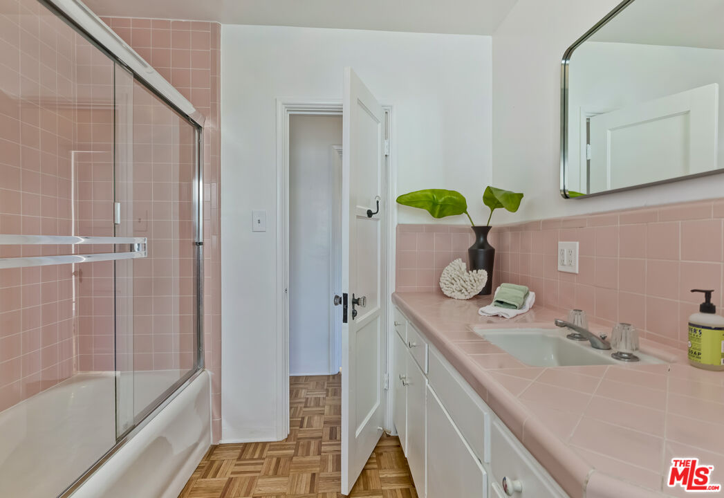 23350 Malibu Colony Road, Unit 109 Malibu, CA 90265 - Photo 55 of 61 a bathroom with a granite countertop sink a toilet and shower