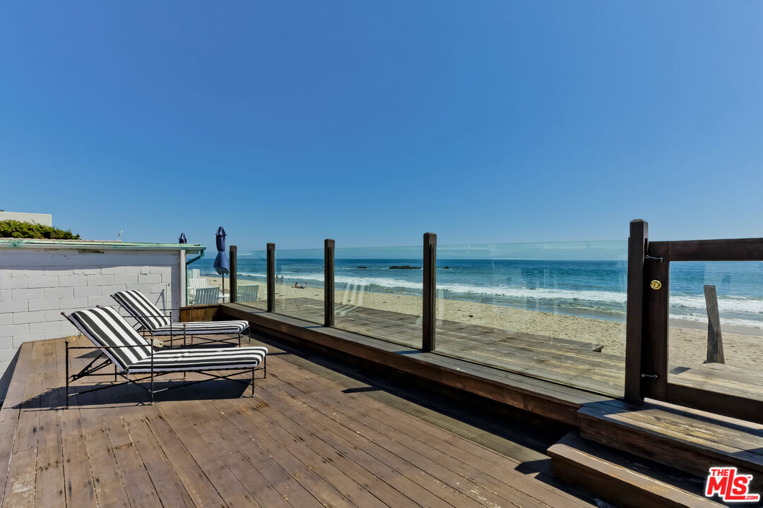 23350 Malibu Colony Road, Unit 109 Malibu, CA 90265 - Photo 58 of 61 a view of a balcony with wooden floor and outdoor space