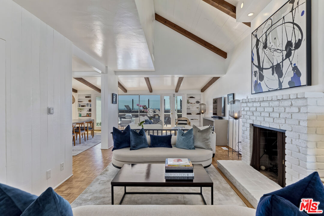 23350 Malibu Colony Road, Unit 109 Malibu, CA 90265 - Photo 6 of 61 a living room with furniture and fireplace