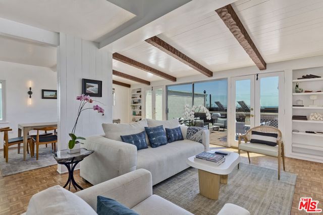a view of a kitchen with a sink and cabinets
