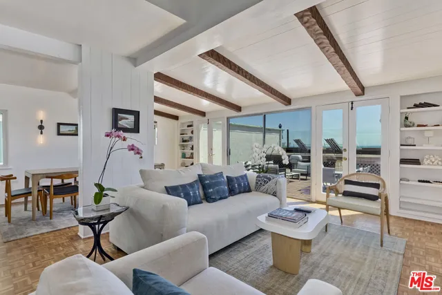 a view of a kitchen with a sink and cabinets
