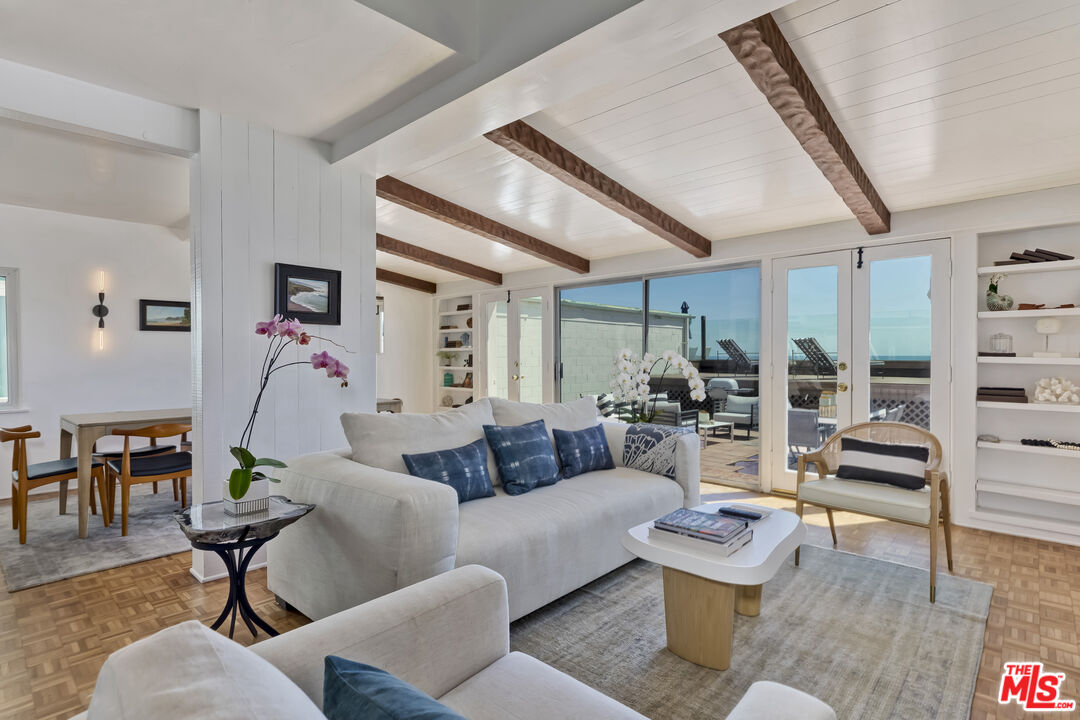 23350 Malibu Colony Road, Unit 109 Malibu, CA 90265 - Photo 9 of 61 a living room with furniture and wooden floor