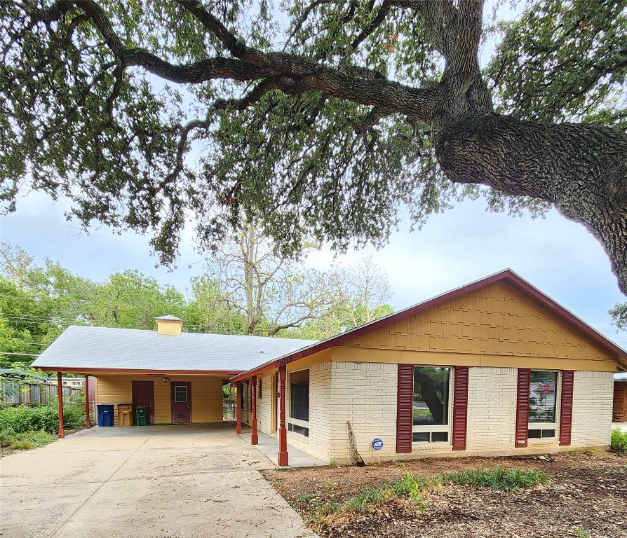 1912 Ridgemont Drive Austin, TX 78723 - Photo 1 of 28 a front view of a house with a garden