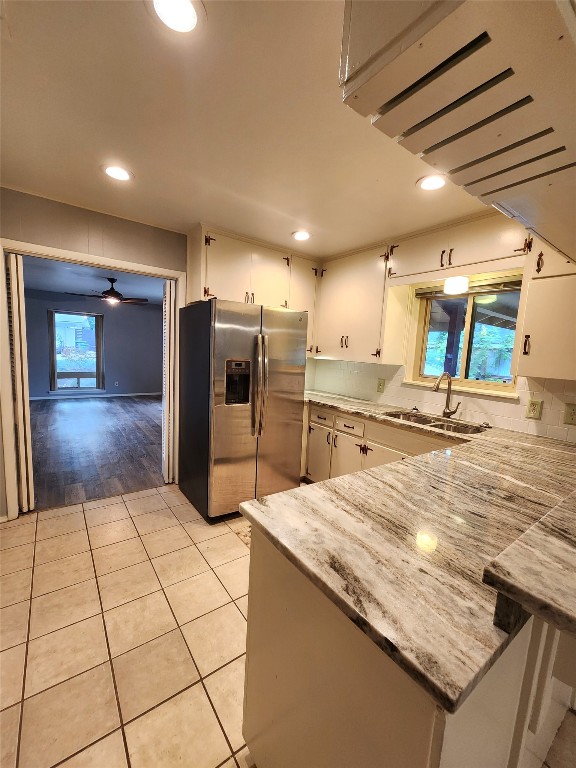 1912 Ridgemont Drive Austin, TX 78723 - Photo 15 of 28 a large kitchen with stainless steel appliances kitchen island granite countertop a large counter top and oven