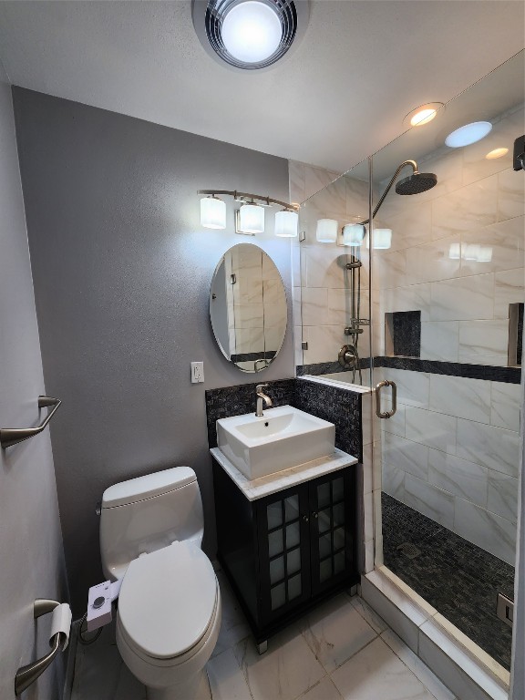 1912 Ridgemont Drive Austin, TX 78723 - Photo 25 of 28 a bathroom with a toilet sink and mirror
